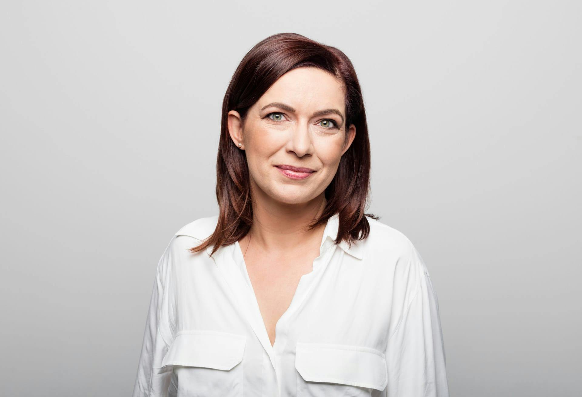 woman looking at camera smirking
