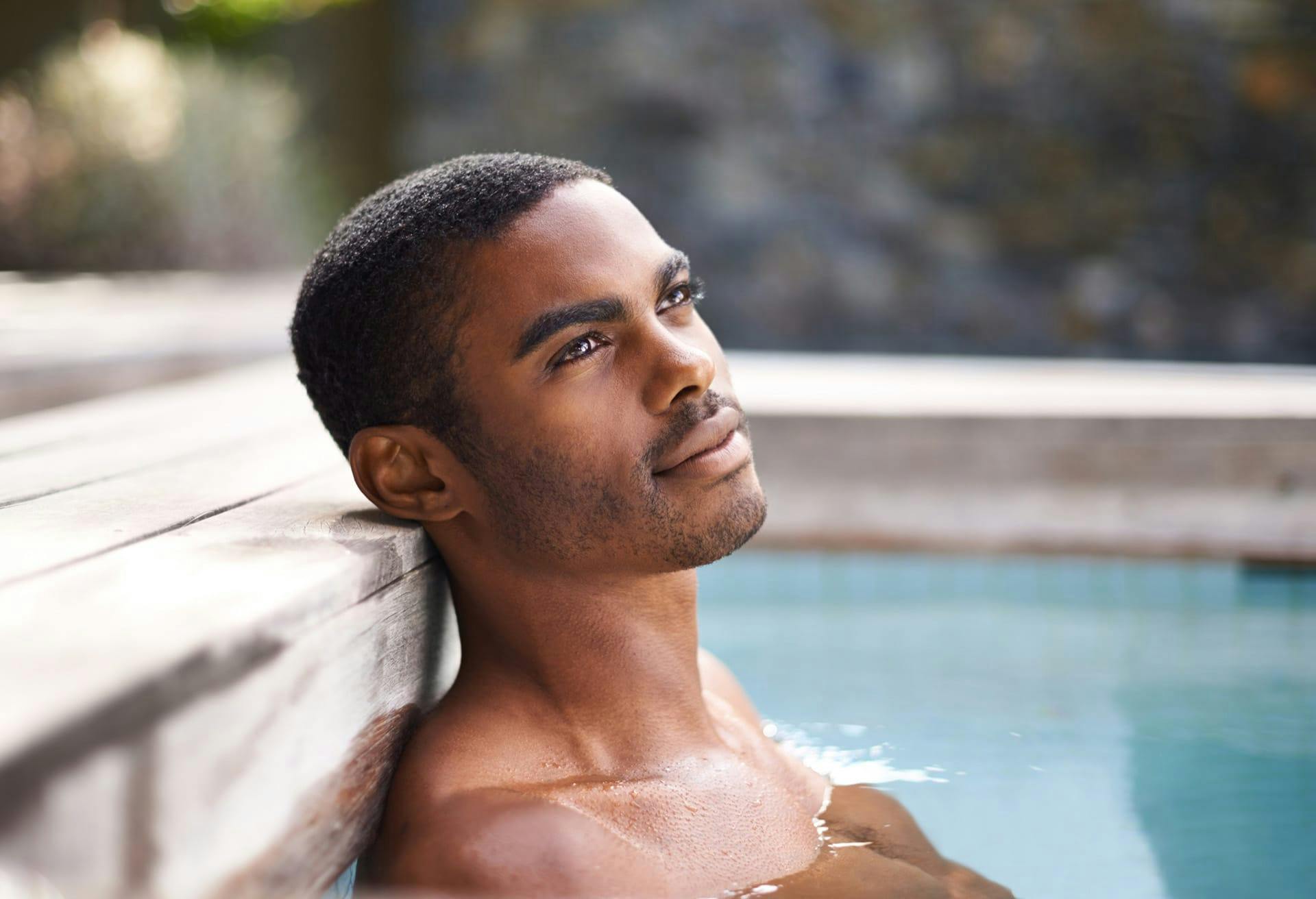 man in pool relaxing