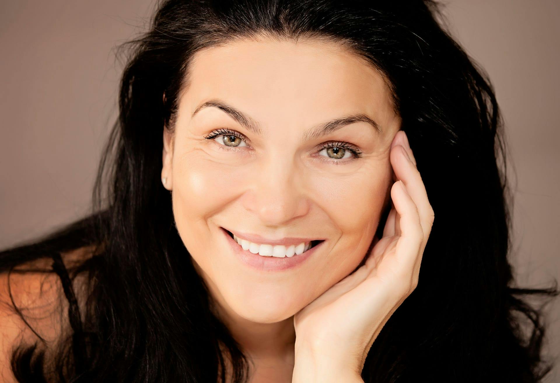 close up of woman smiling at camera