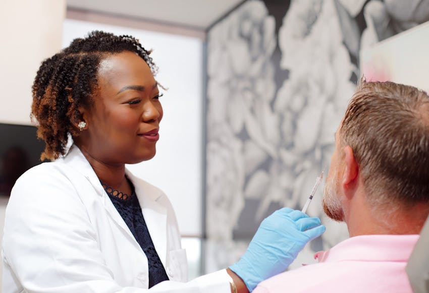 woman about to give man an injection