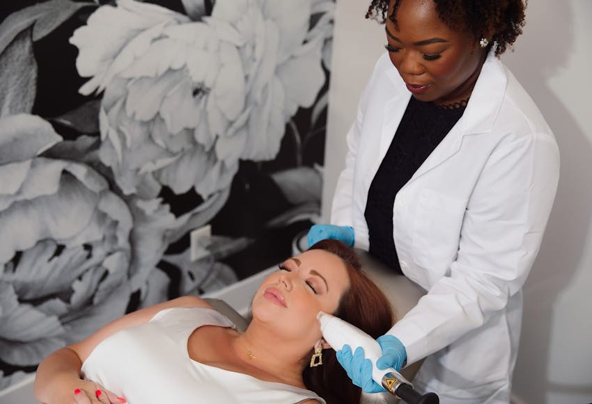 Woman on table getting laser treatment