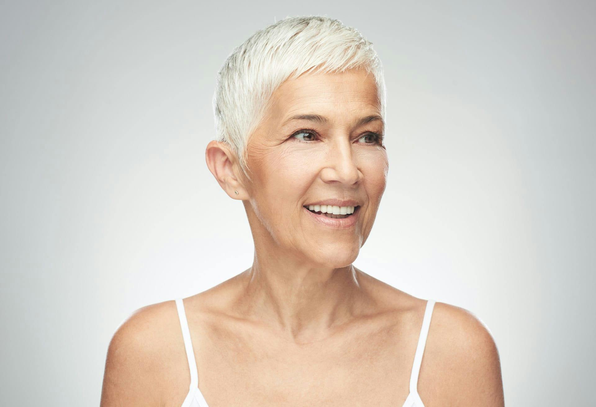 woman smiling and looking off camera