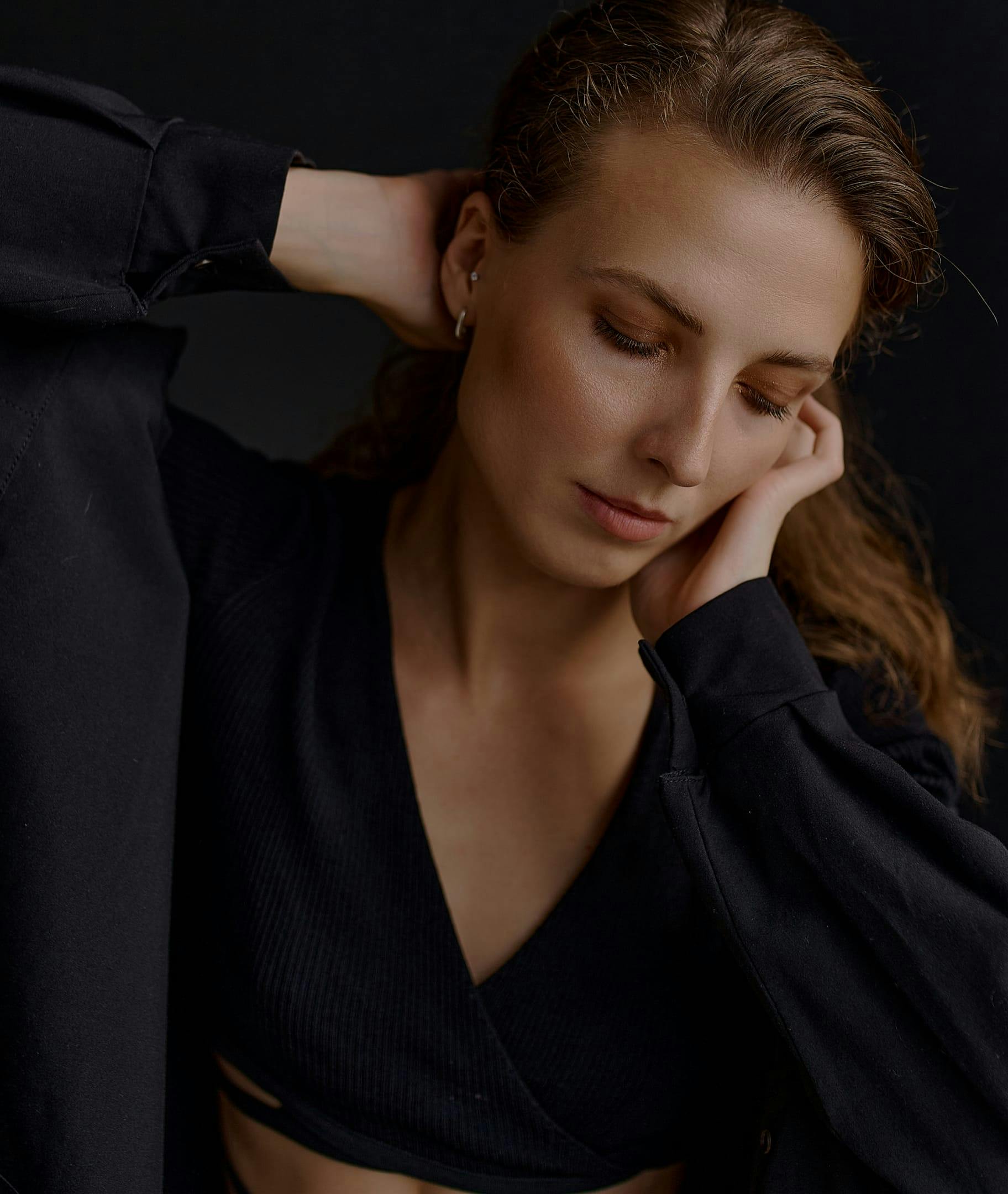 woman with her hands on her head.