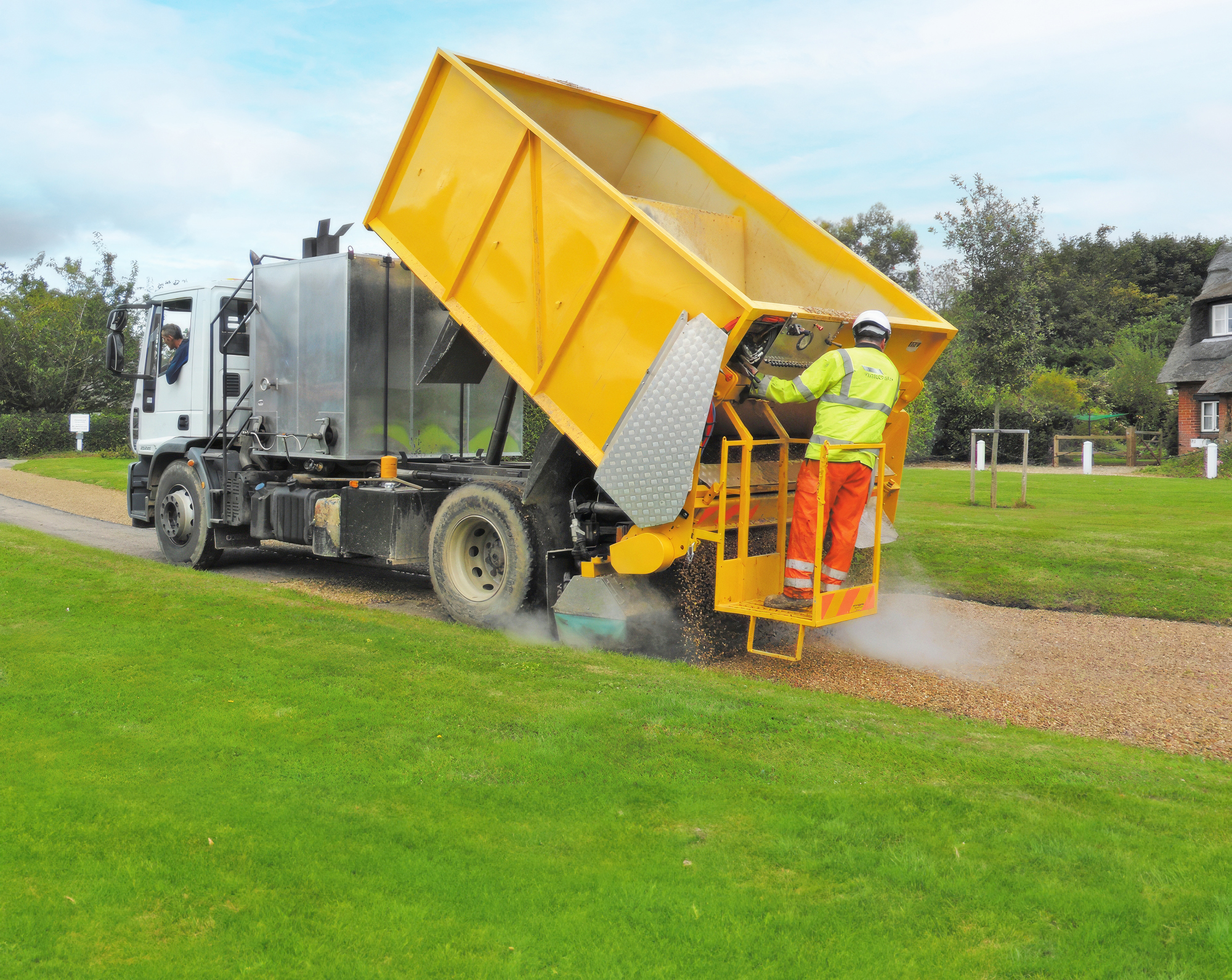 helmet, adult, male, man, person, grass, shoe, worker, glove, vehicle