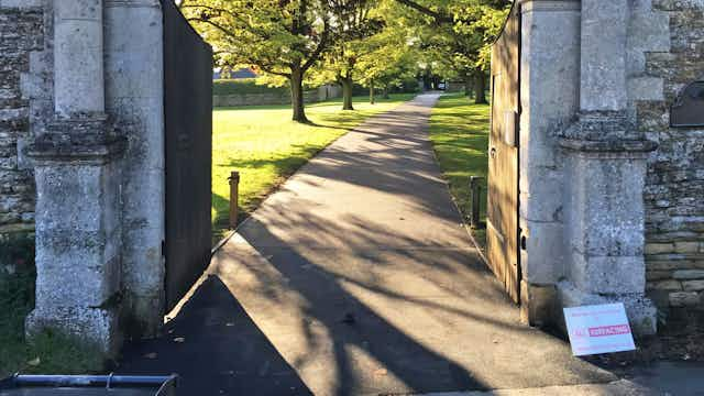 path, walkway, arch, architecture, outdoors, sidewalk, grass, plant