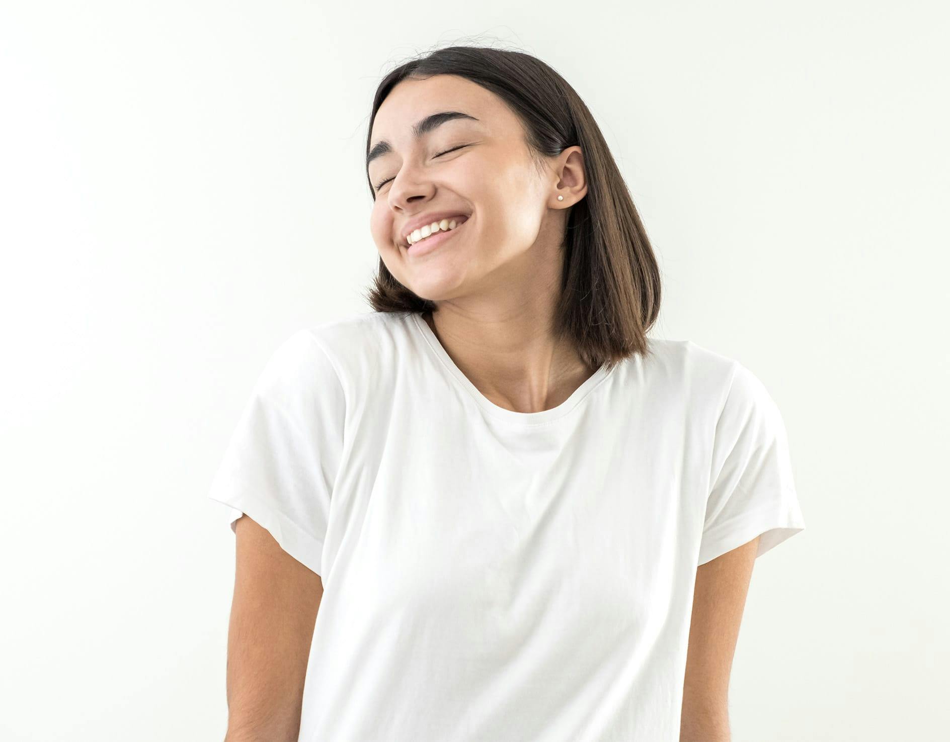 woman holding hand to face