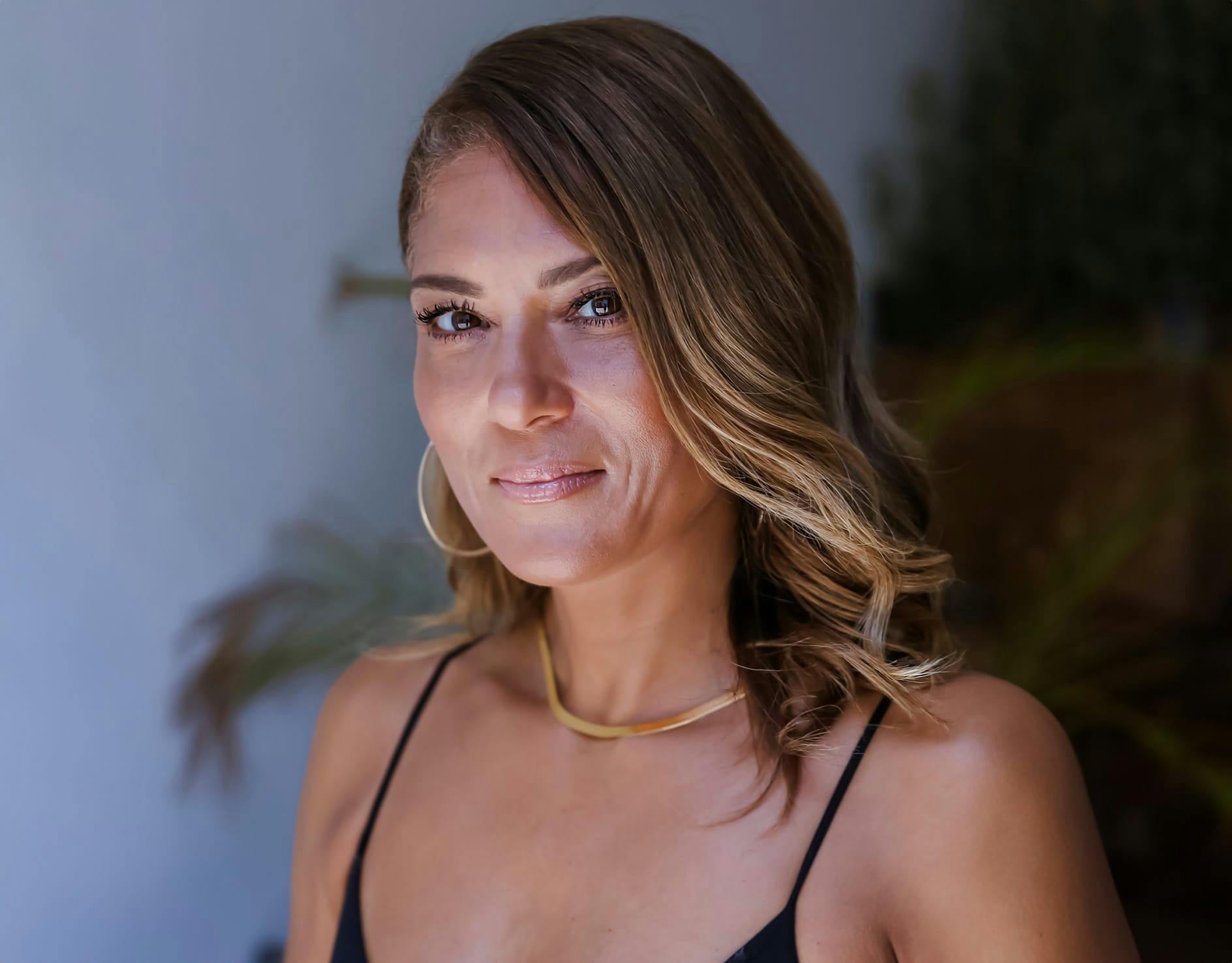 woman holding chin and looking down