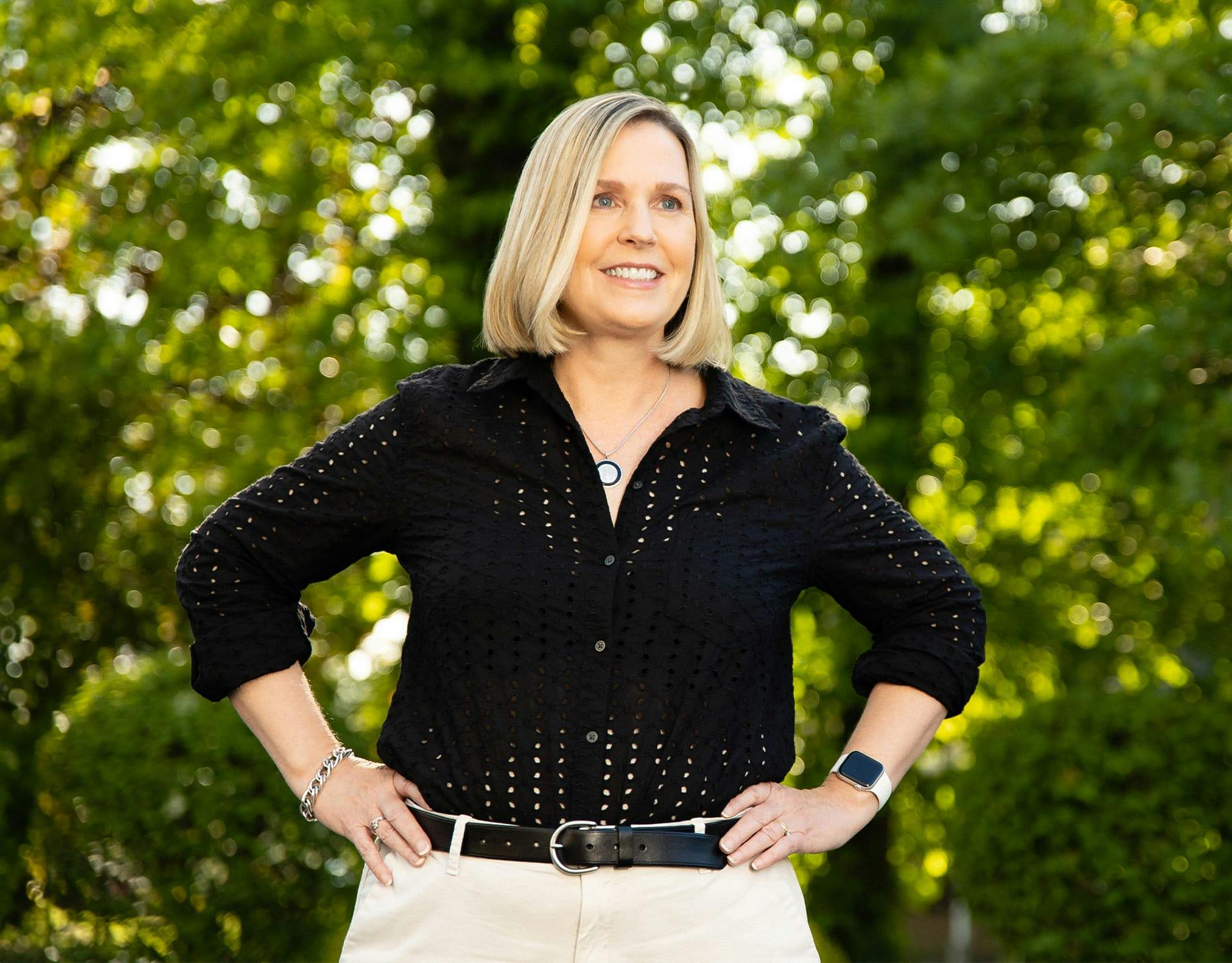 woman with eyes closed enshrining face with hands