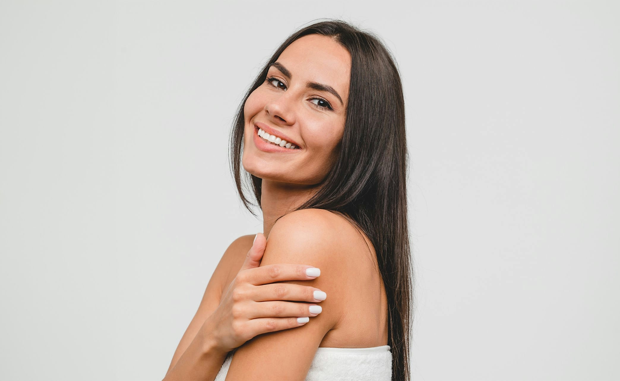 woman with long dark hair smiling