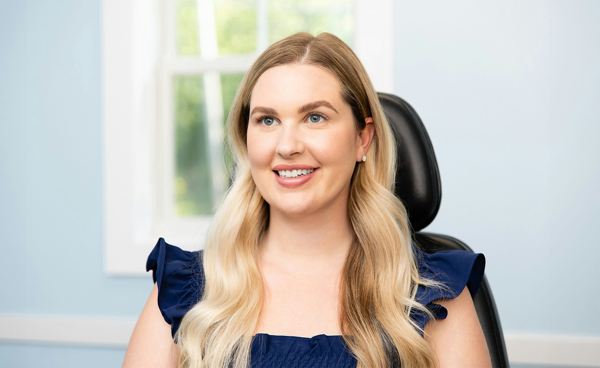 woman looking in mirror