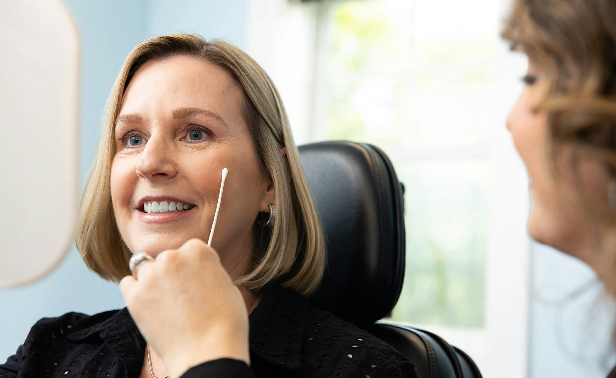 smiling patient in chair