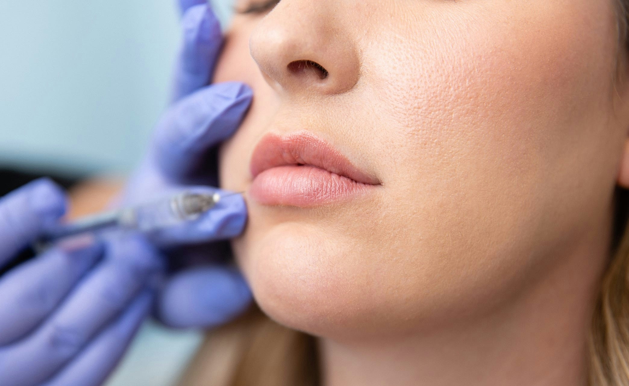 woman with hand at side of face