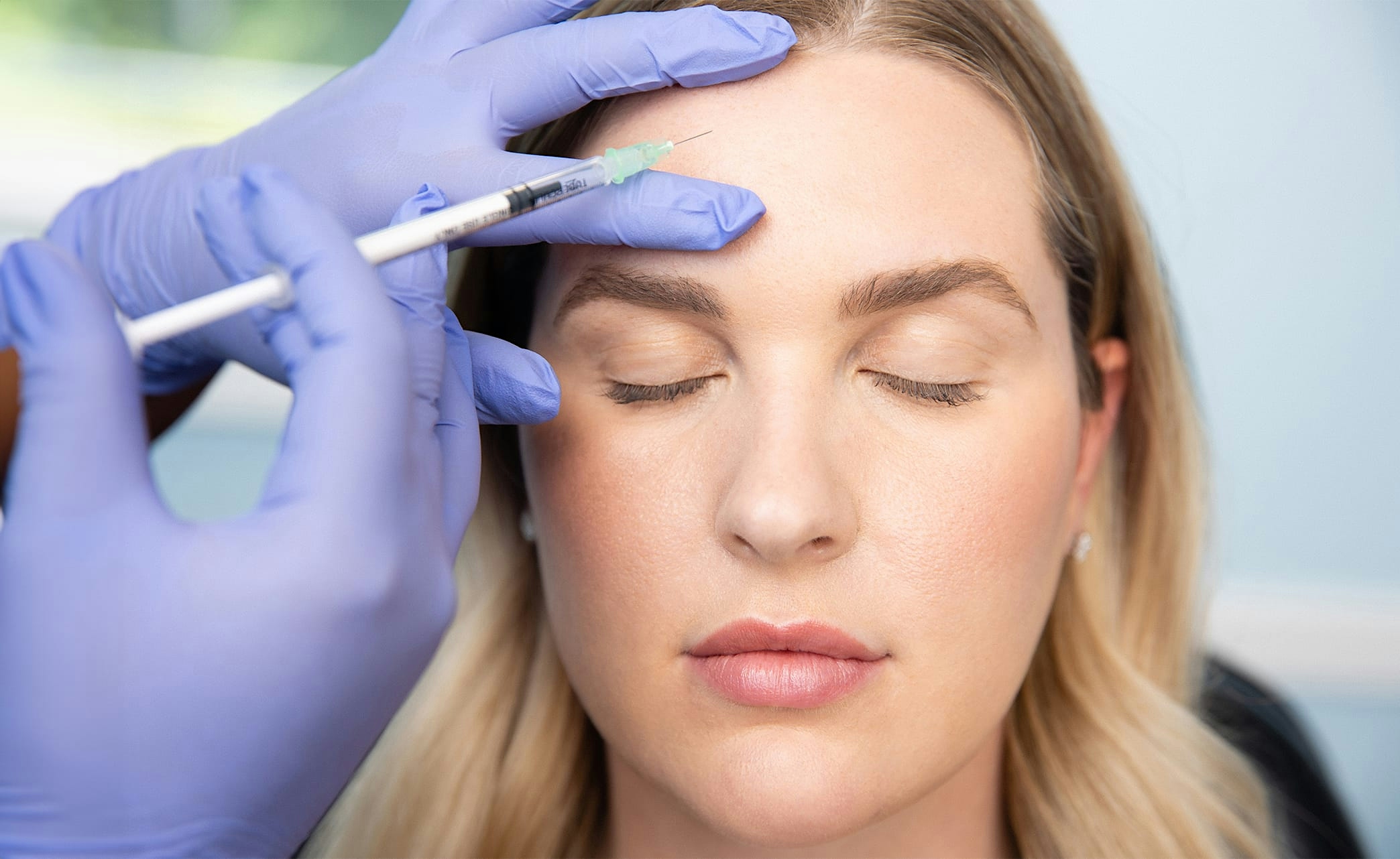 smiling patient looking in mirror