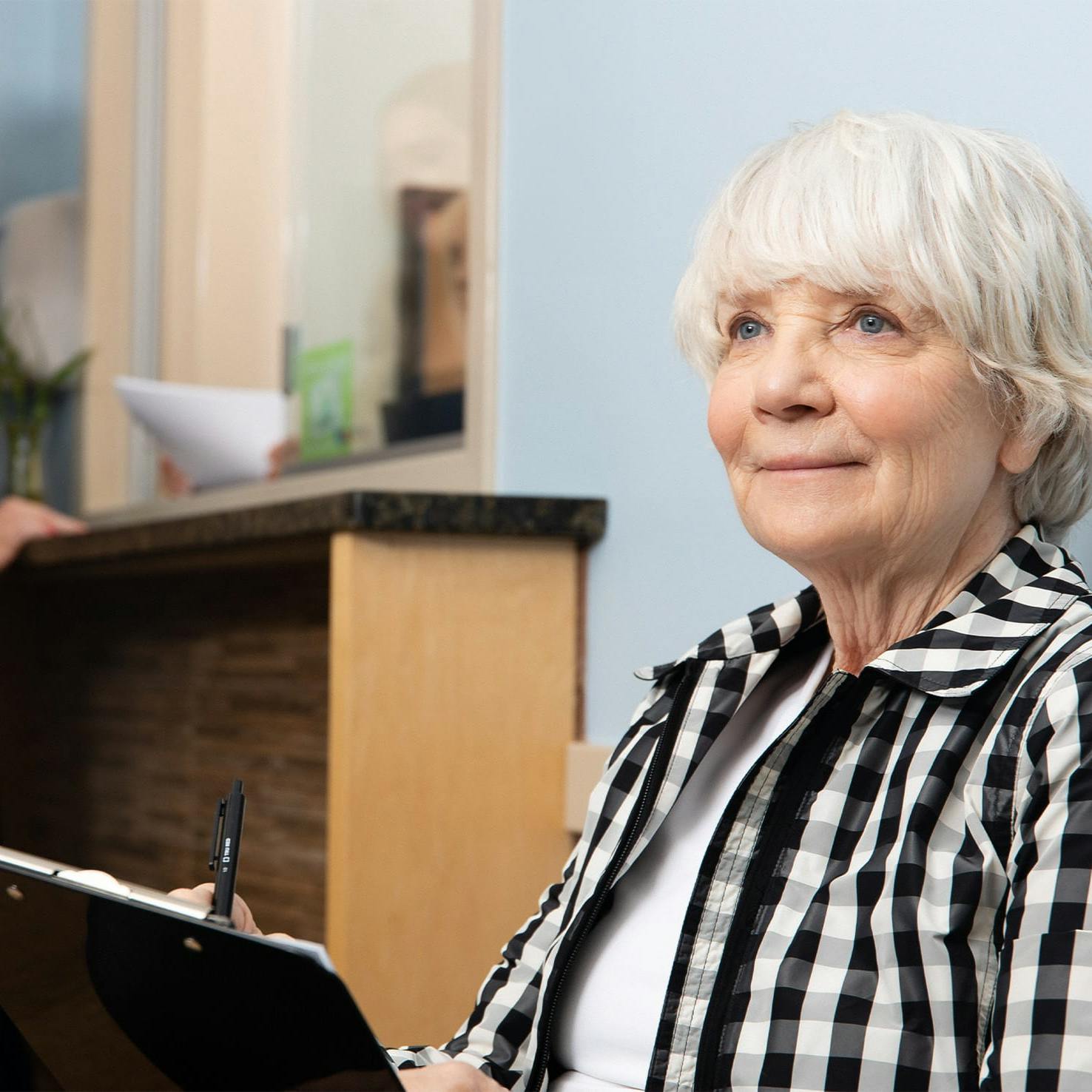 older woman filling out paperwork