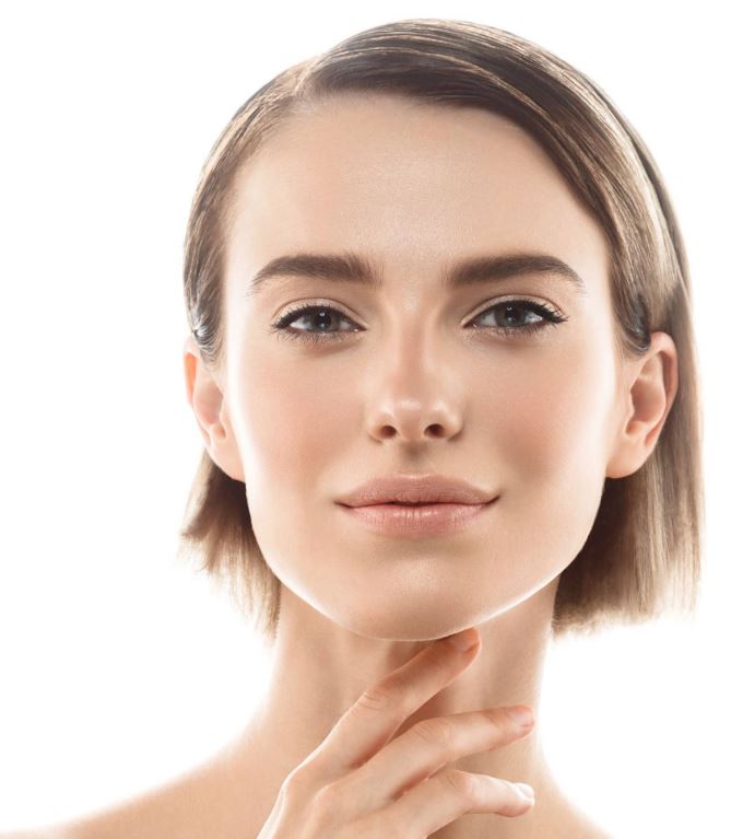 smiling woman putting hand on her neck