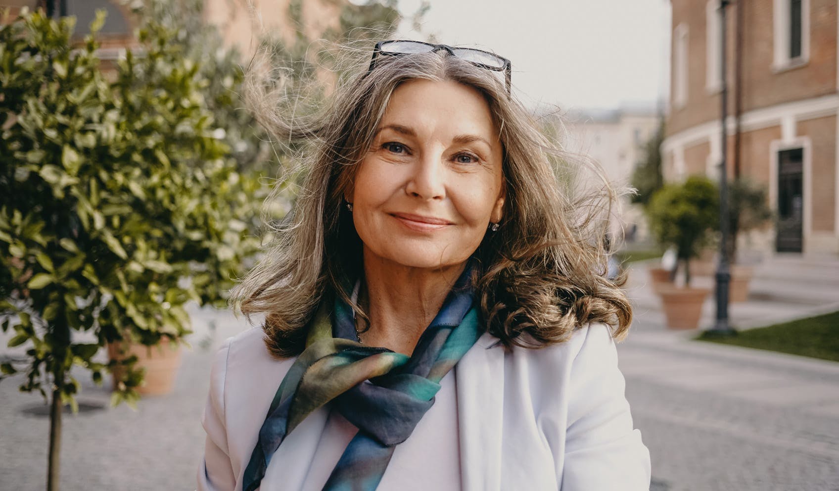 woman smiling and standing outside