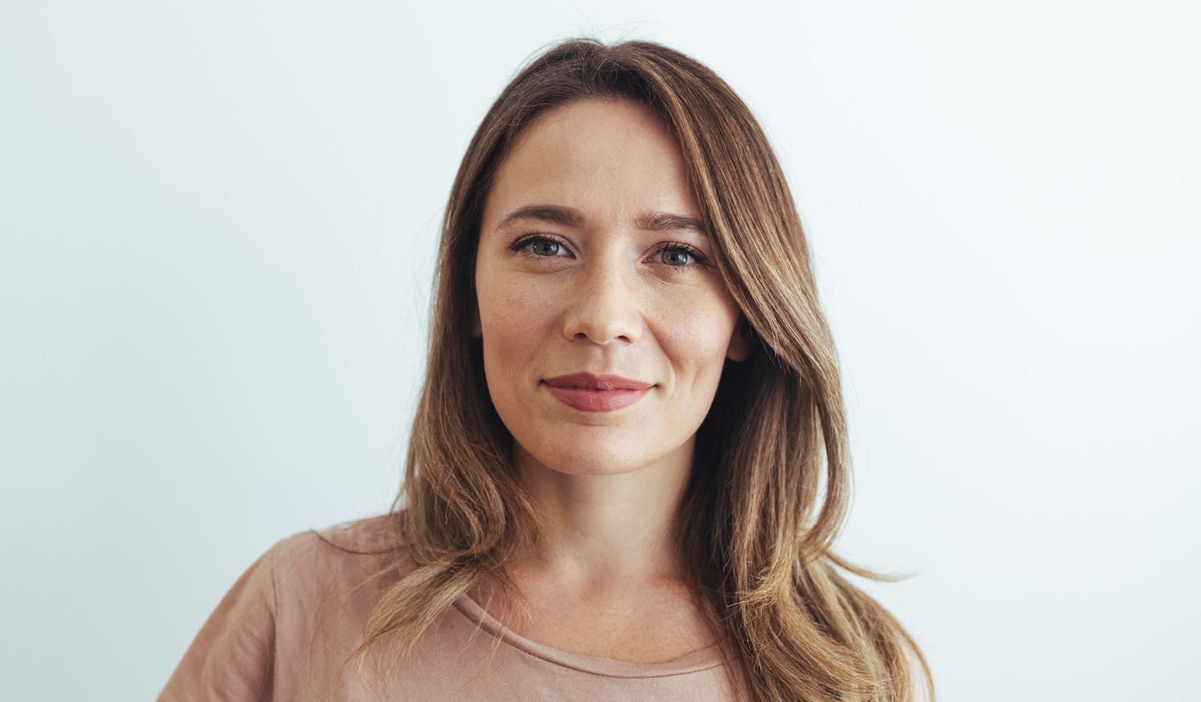 Woman smiling and looking straight ahead