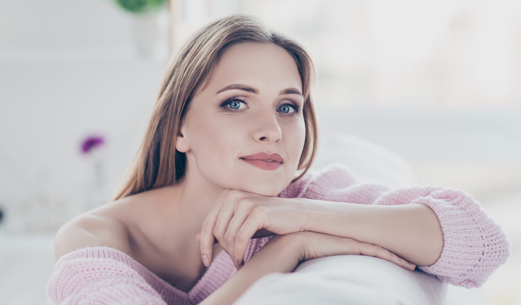 woman resting chin on arm