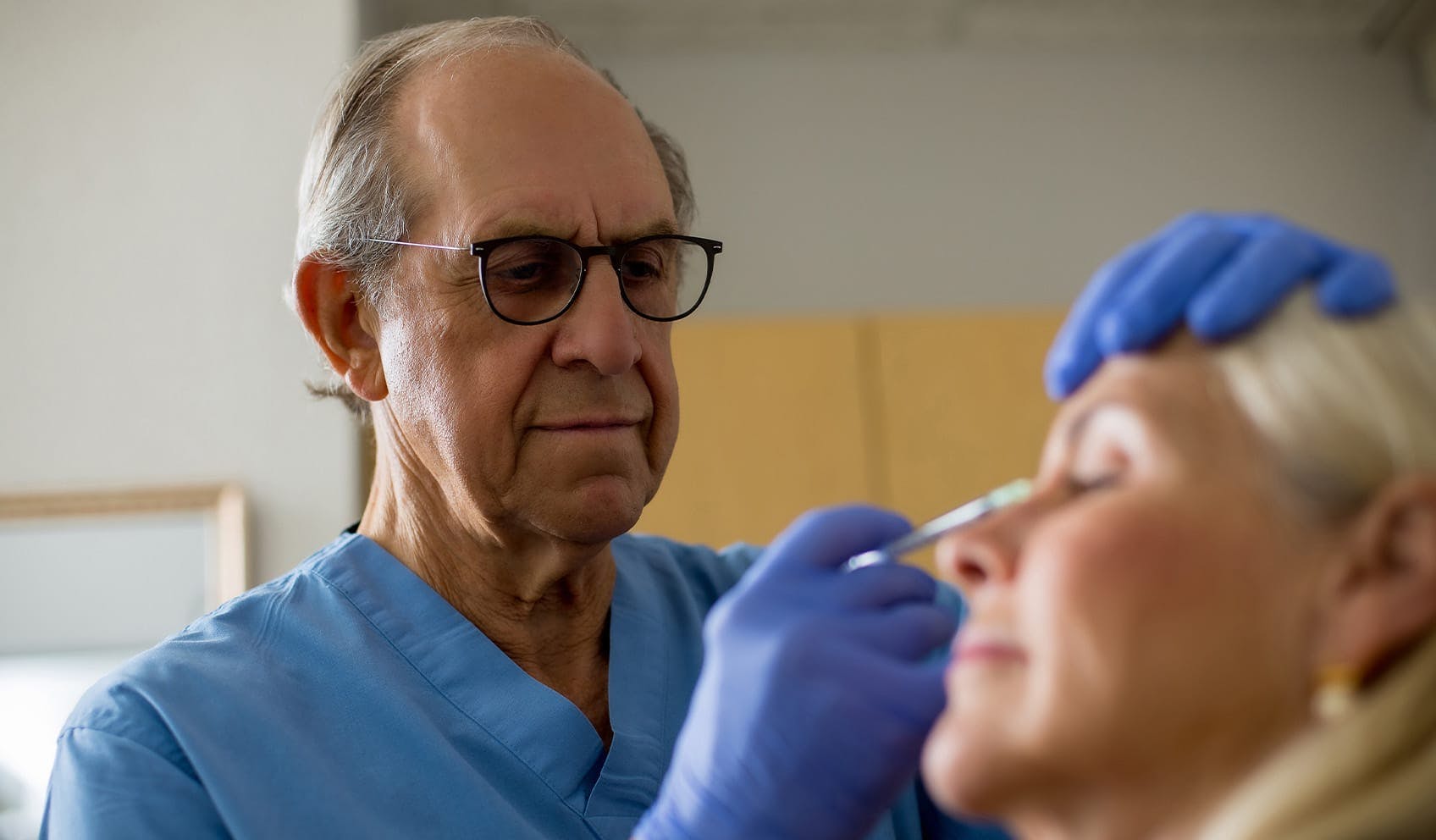 Dr. Miller treating patient with injectables