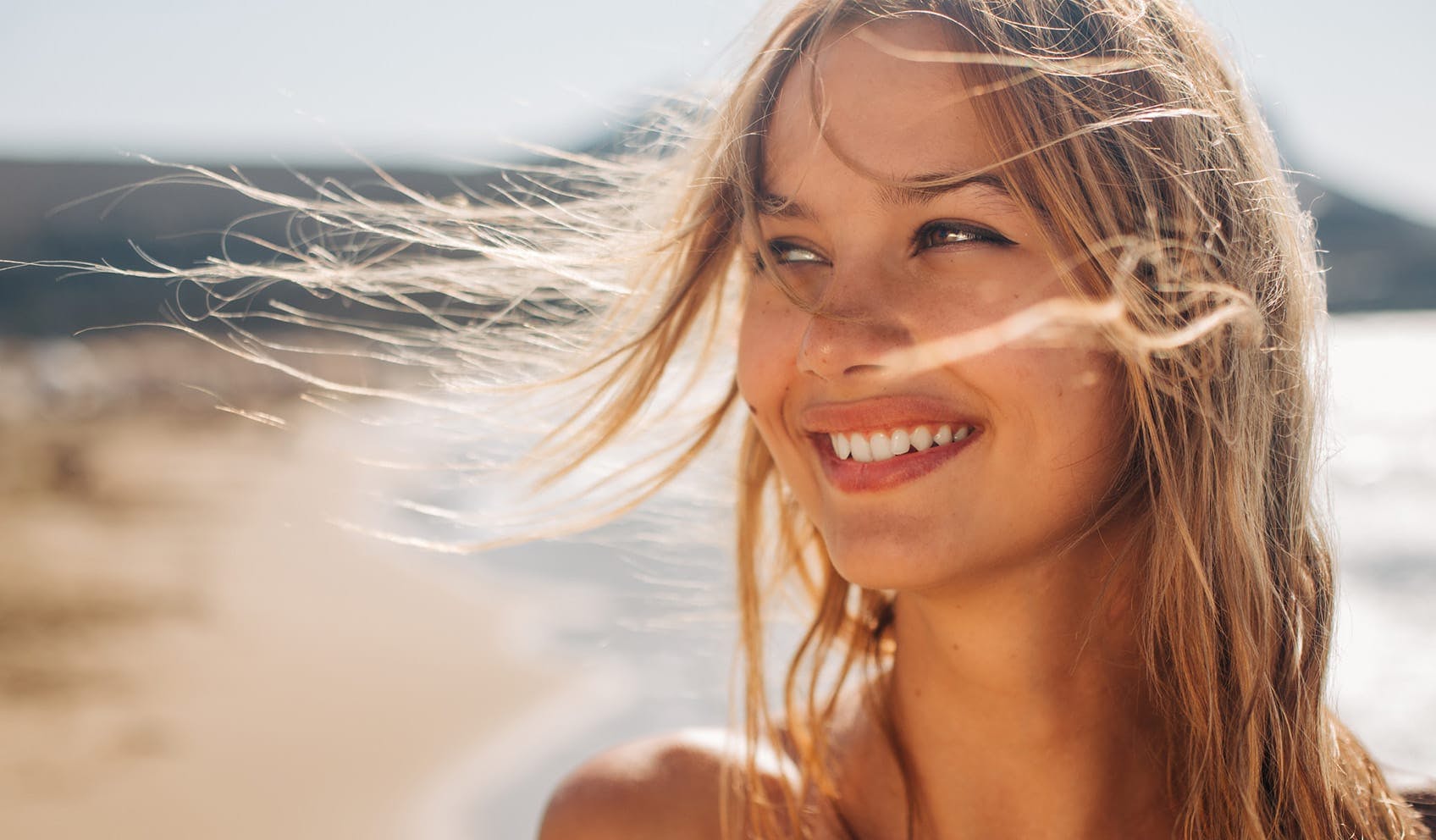 Woman smiling on the beach