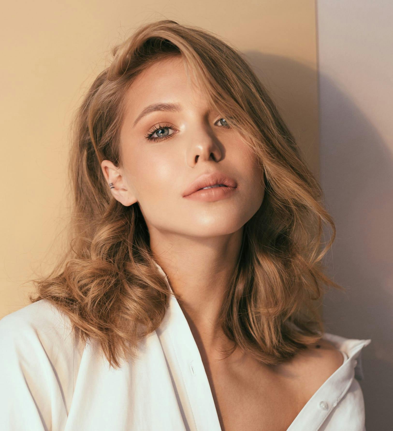 Blonde model wearing white shirt