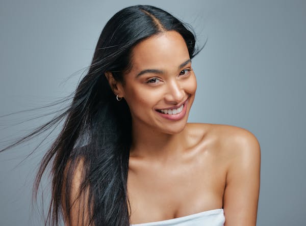 Woman with black hair smiling