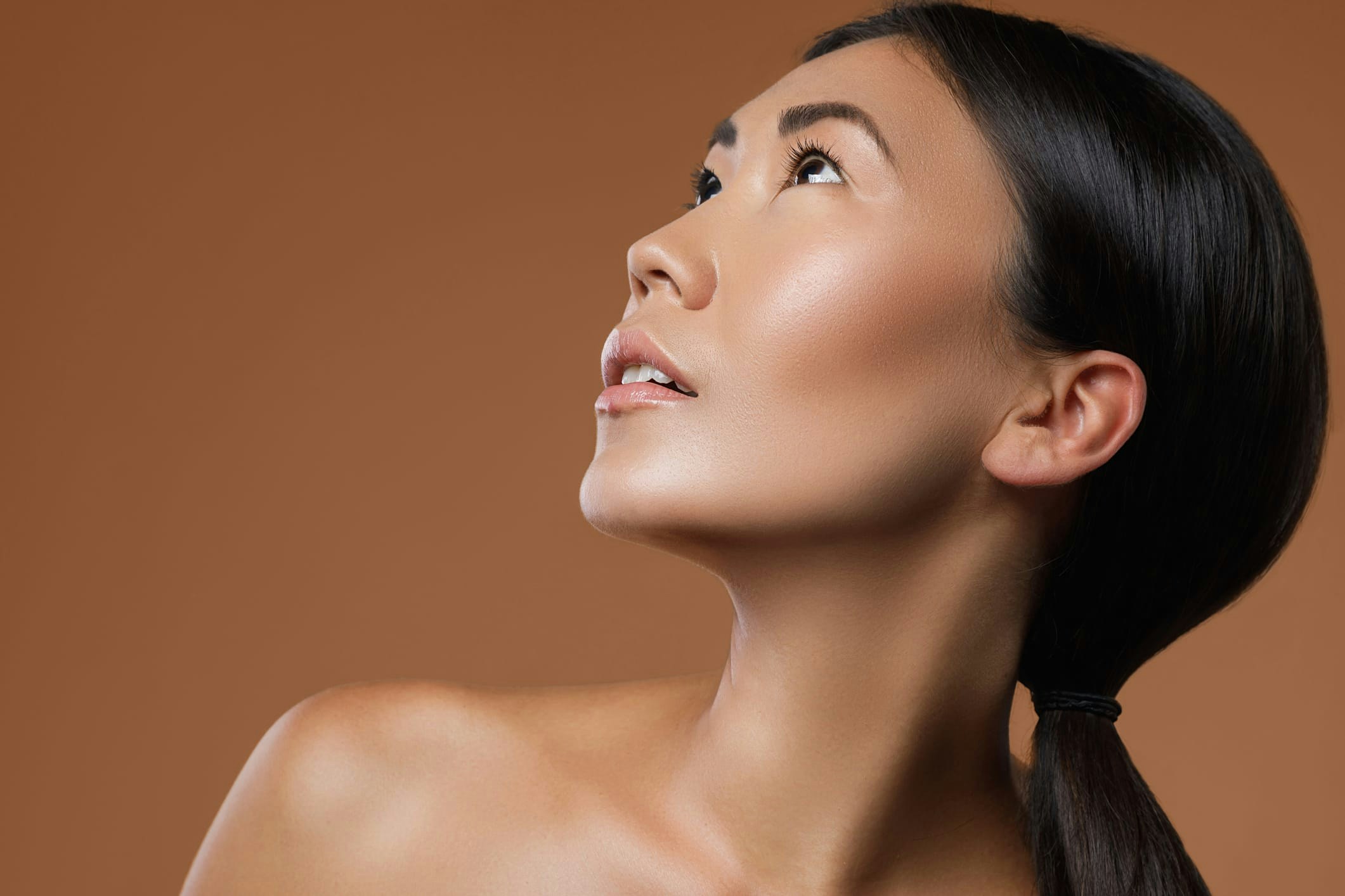 woman with long dark hair in a ponytail