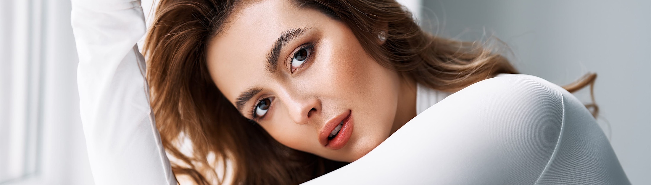 woman in a long sleeve white top