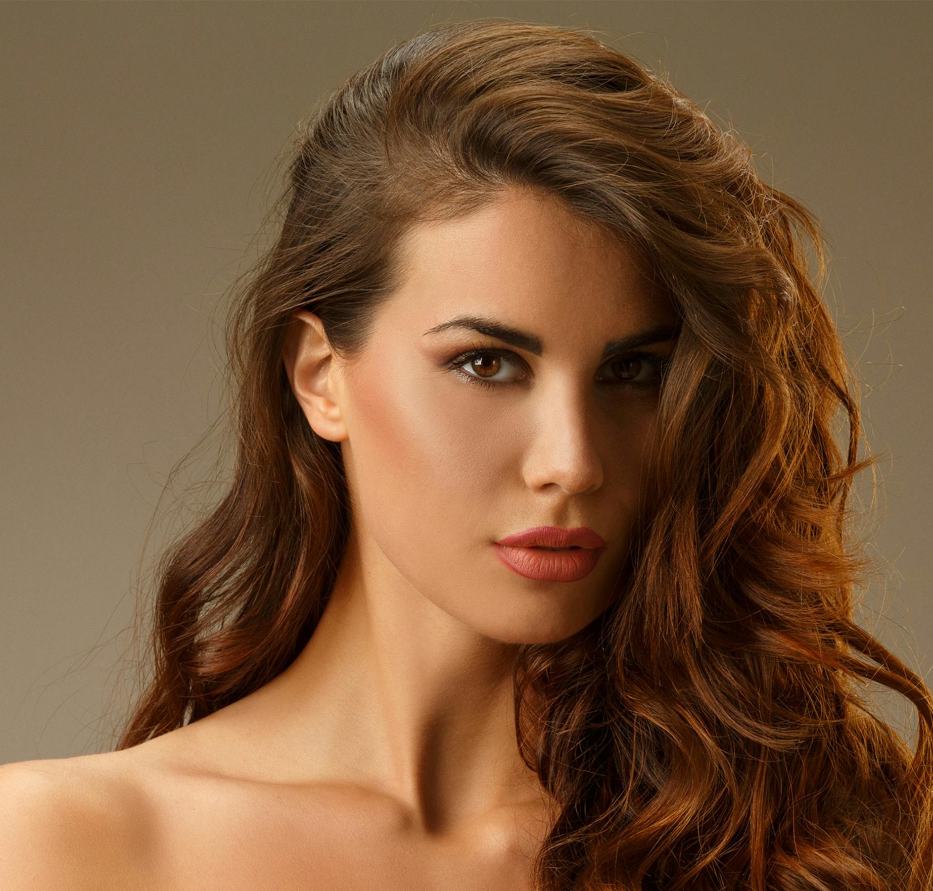 hair in face brown gray background