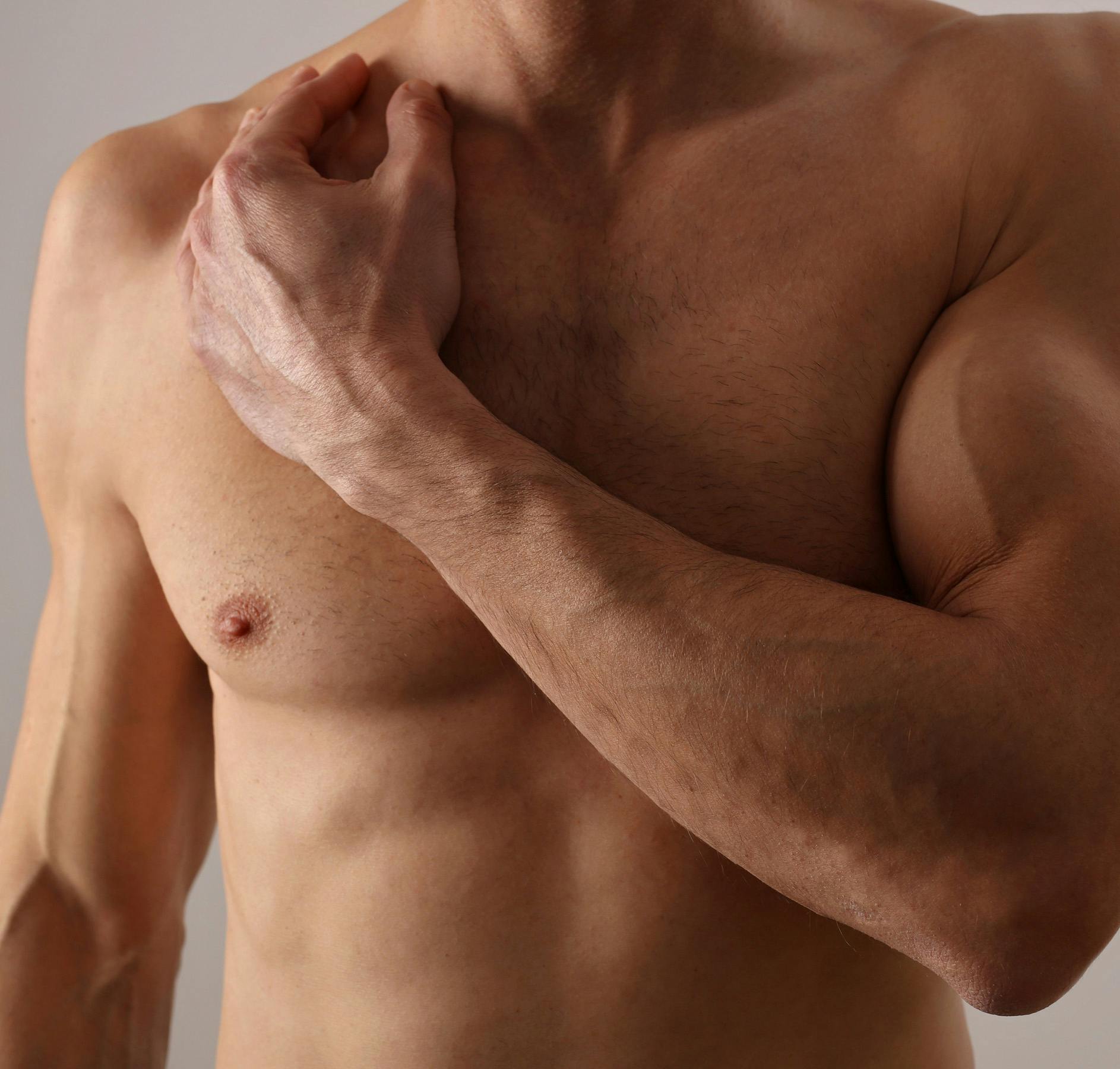 bare chest arm across chest