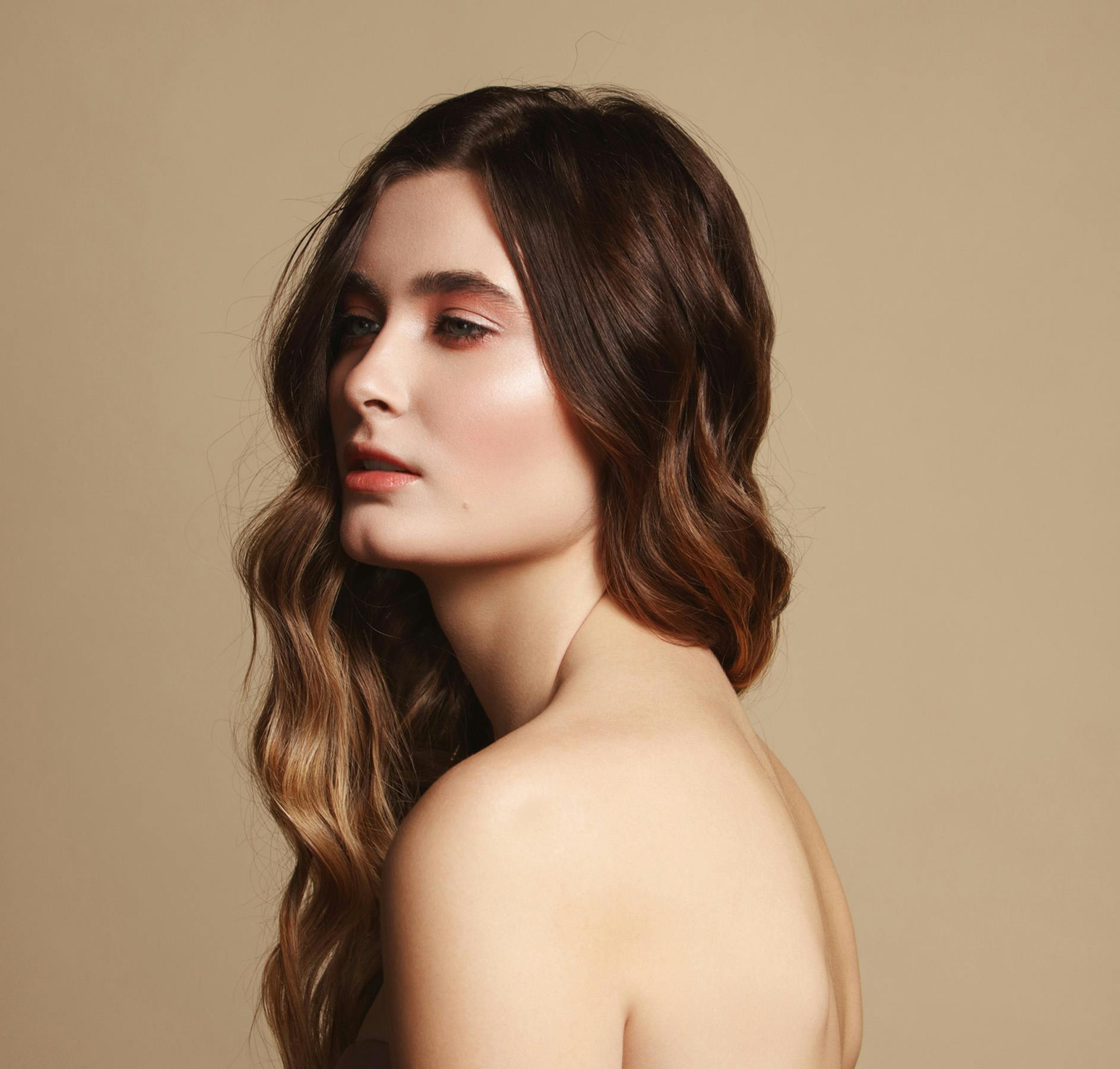 turned to side looking away creme colored background