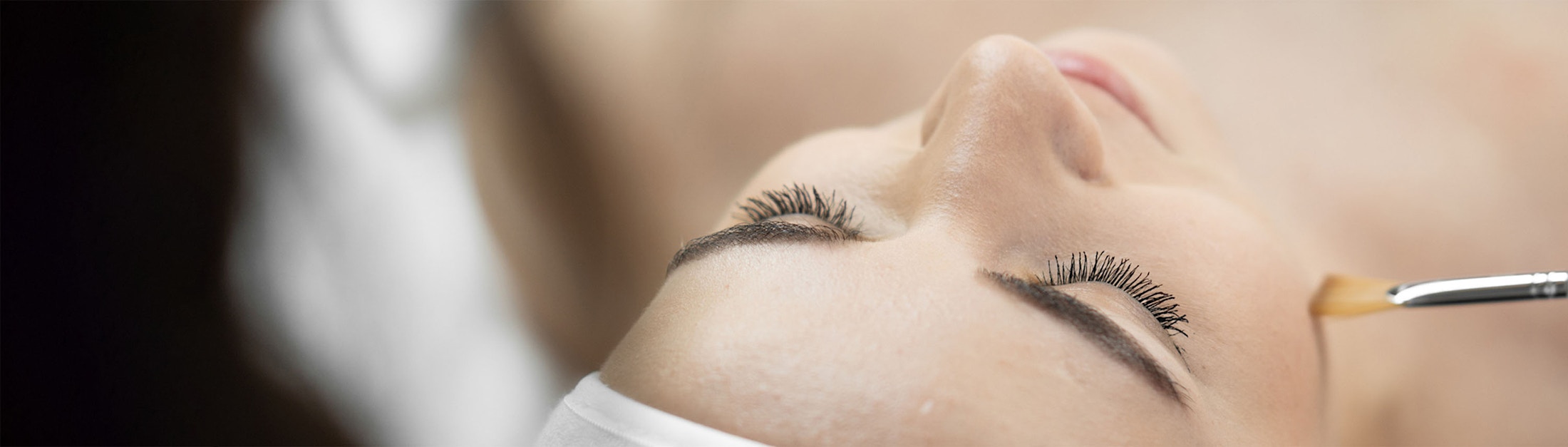 facial brush on cheek