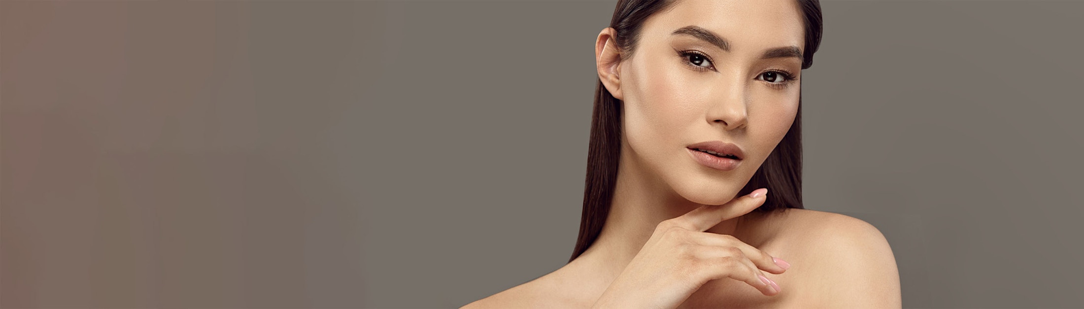 finger under chin slight look gray background