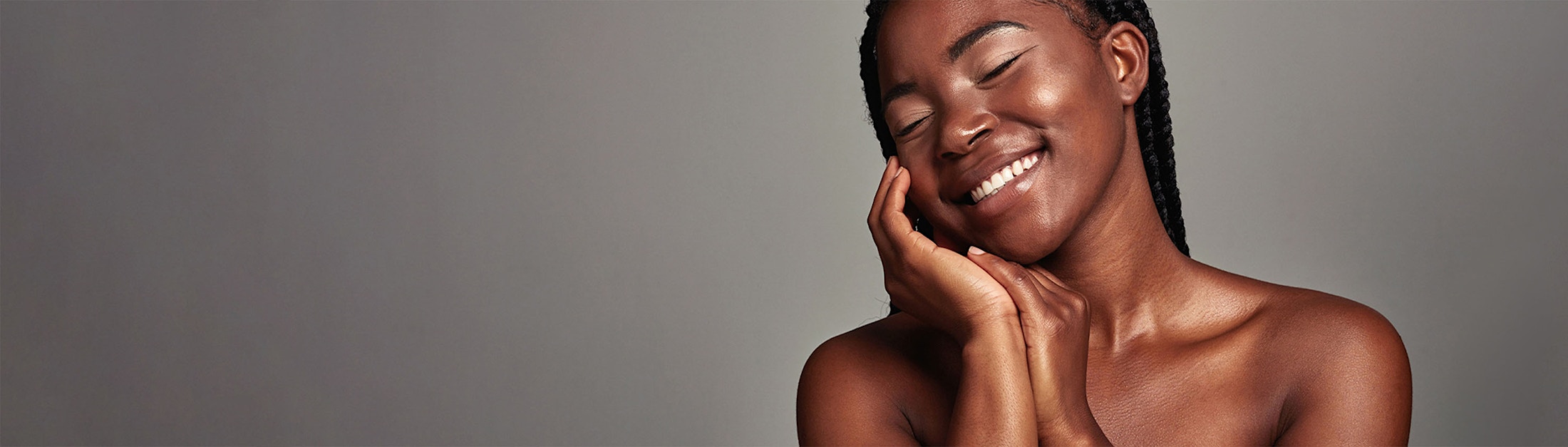 smiling and touching face