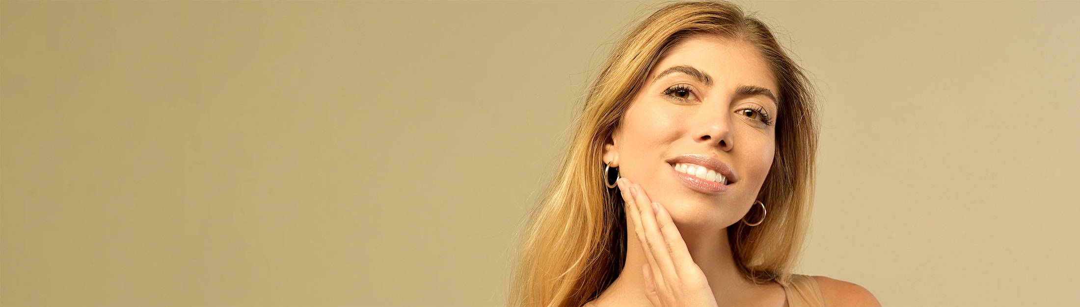 hand to chin subdued yellow background