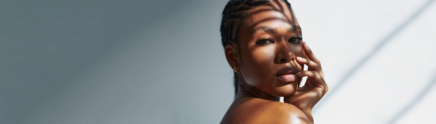 slight look over shoulder gray background