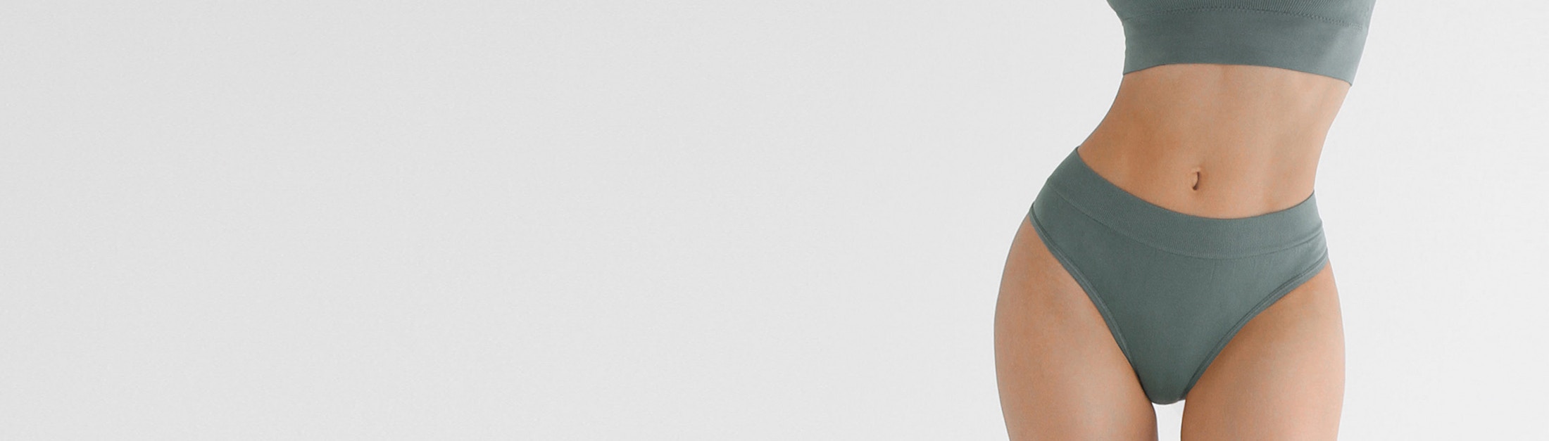 woman in teal undergarments