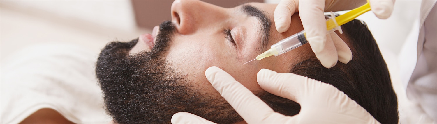 bearded looking ahead light blue background