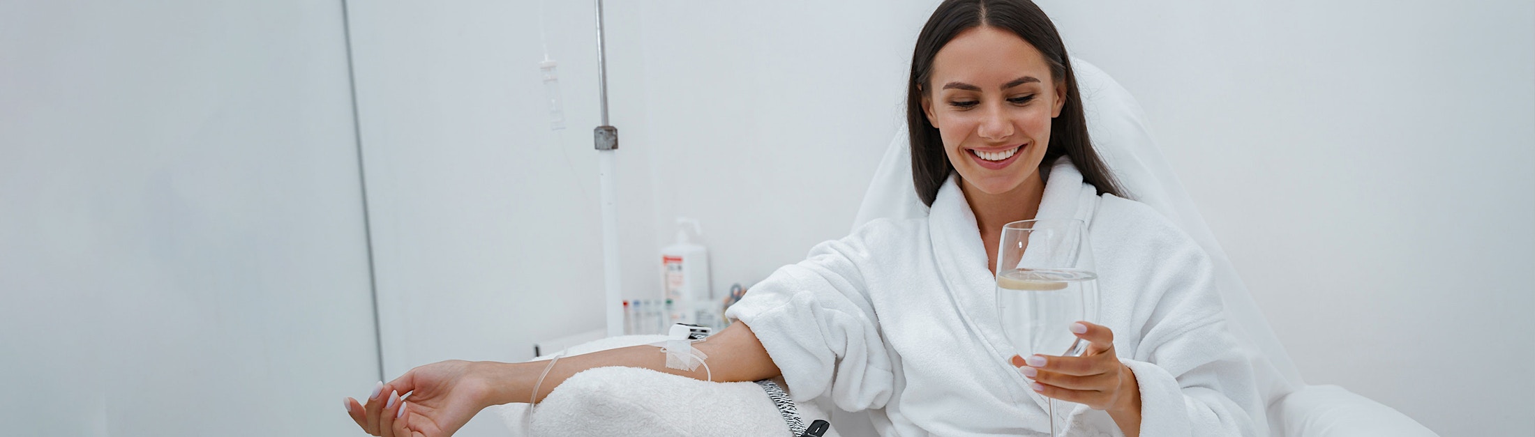 woman in IV chair smiling