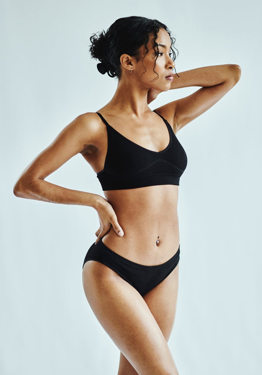 Gorgeous woman with flat Tummy in Basic undergarments showing off her tummy tuck