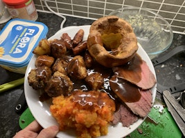 A roast dinner smothered in gravy