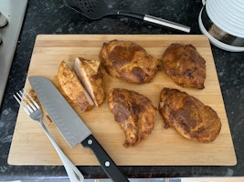 Chipotle chicken on a chopping board