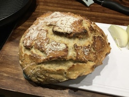 Freshly baked artisan bread on a chopping board