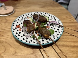 A plate of 3 skewers of Lamb Sheekh Kabab