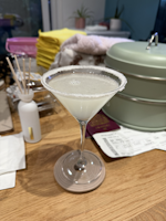 Glass of vanilla sidecar on a messy table