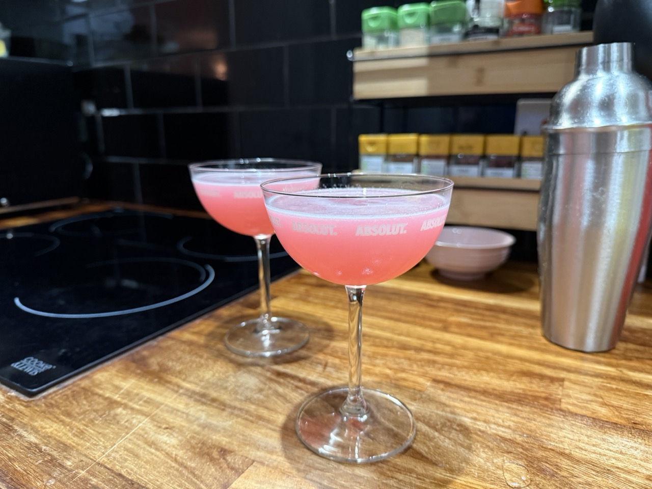 Two glasses of cosmopolitan in coupe glasses