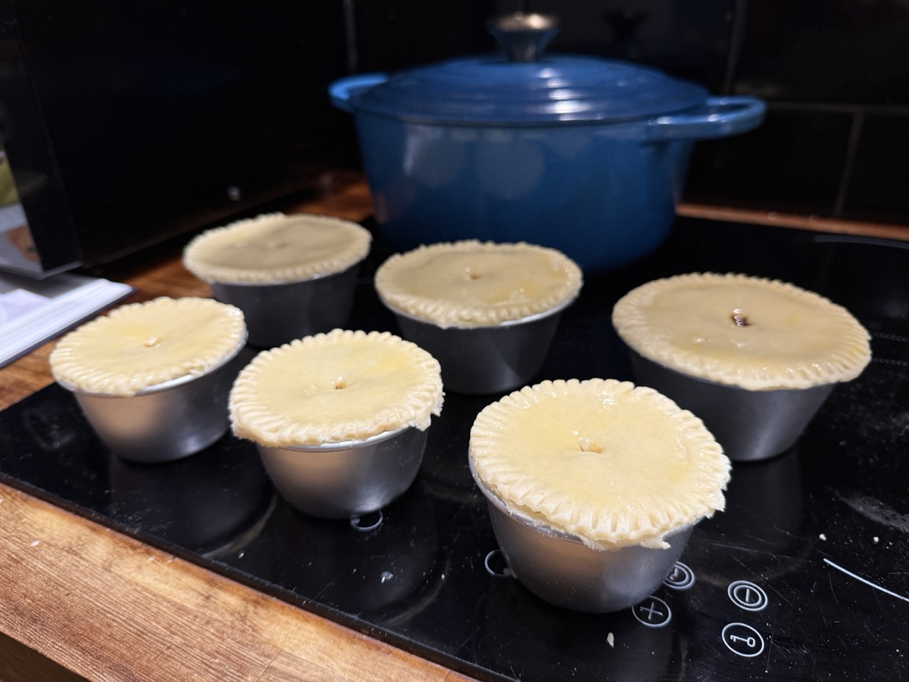 6 braised beef pies ready for the oven