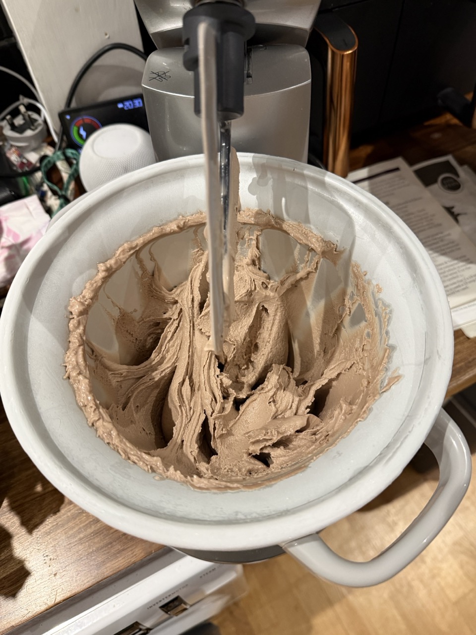 Chocolate hazelnut gelato being mixed in the stand mixer freezer bowl