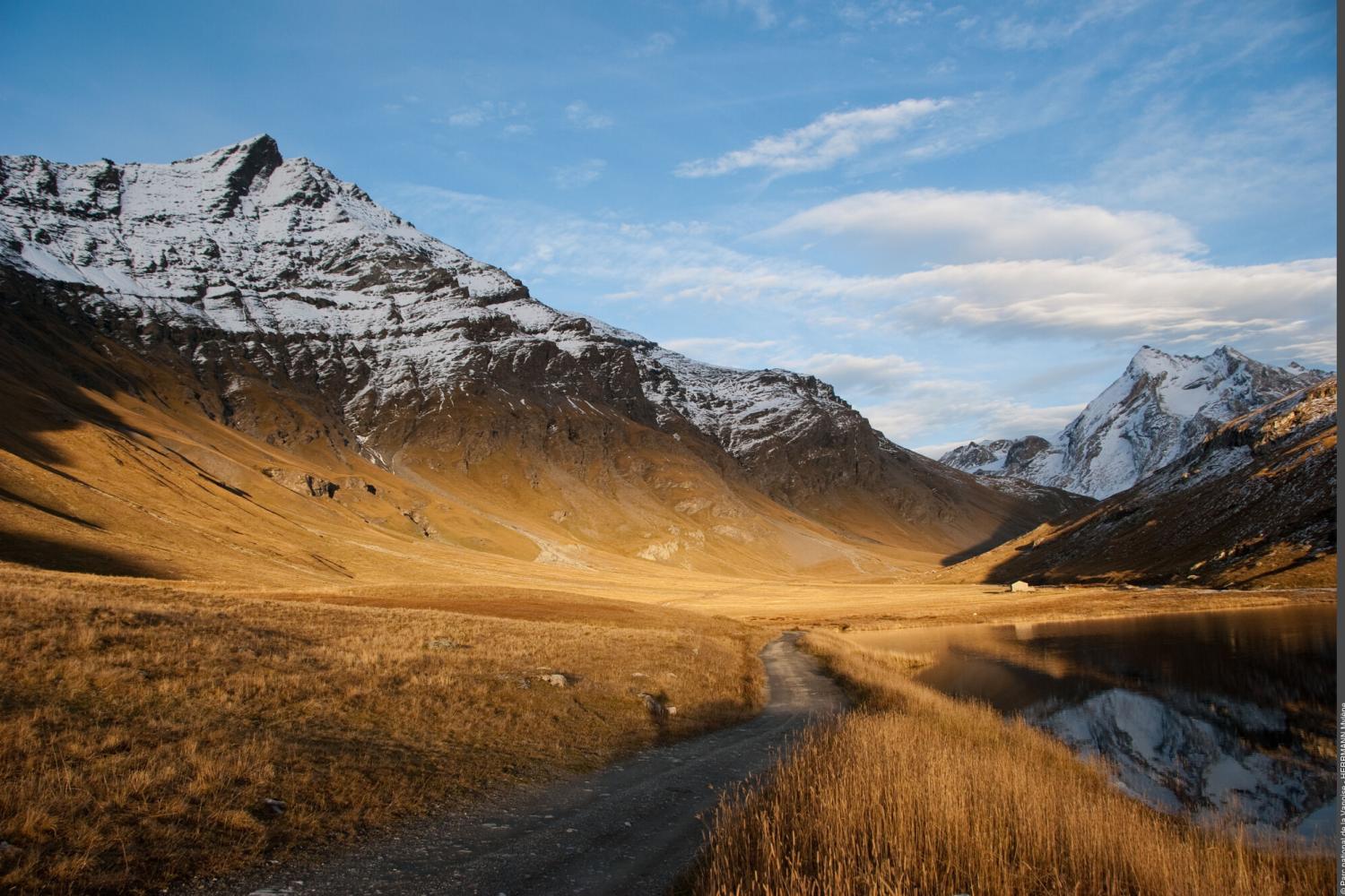 Mountain landscape in autumn, beautiful brown tones with a snow-covered peak.
