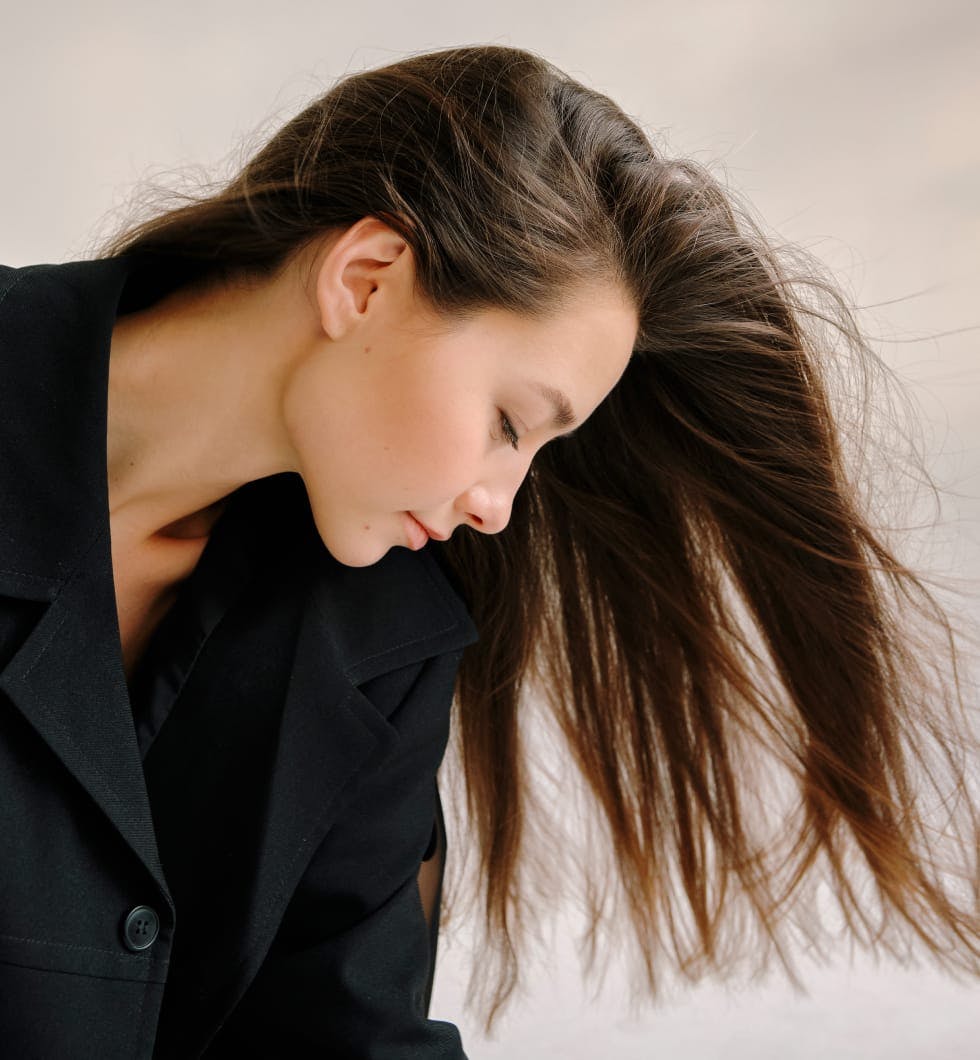 Woman with her hair flowing in the wind